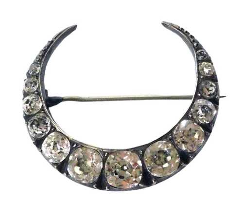 A Victorian paste set crescent moon brooch, in white metal, boxed for AO Faulkner Manufacturing...