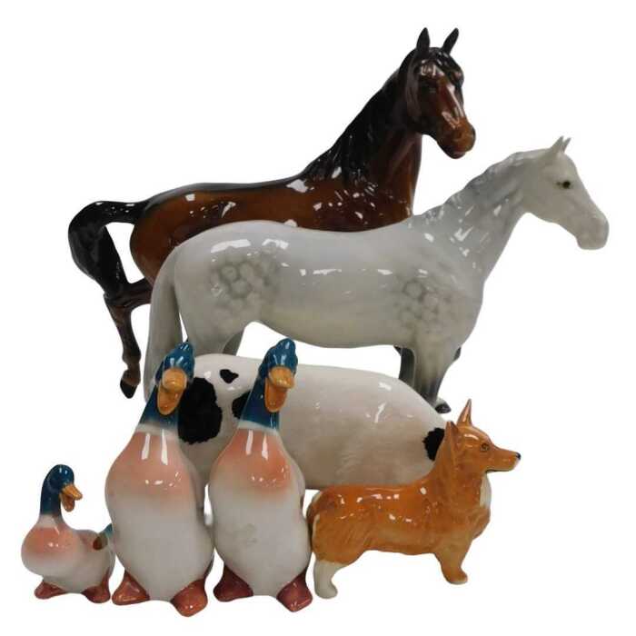 A Beswick pottery dapple grey horse, a brown horse, a Corgi, three mallards, and a Royal Doulton...