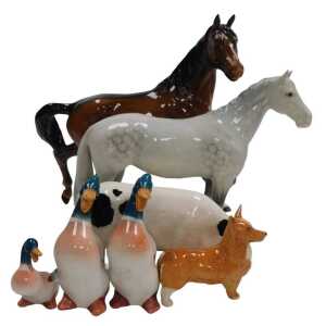A Beswick pottery dapple grey horse, a brown horse, a Corgi, three mallards, and a Royal Doulton...