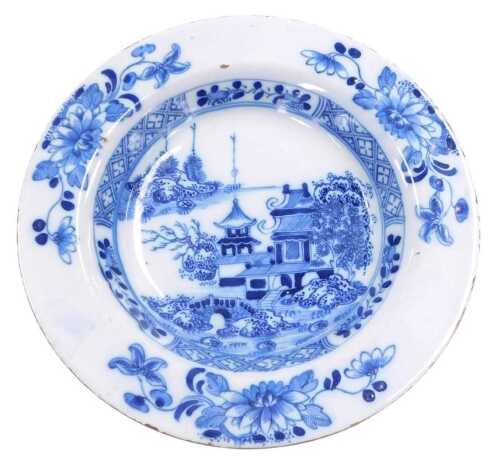 A late 18thC English Delftware soup plate, possibly Liverpool, painted centrally with a...
