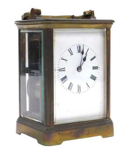 A late 19thC brass carriage clock, rectangular enamel dial bearing Roman numerals, twin barrel...