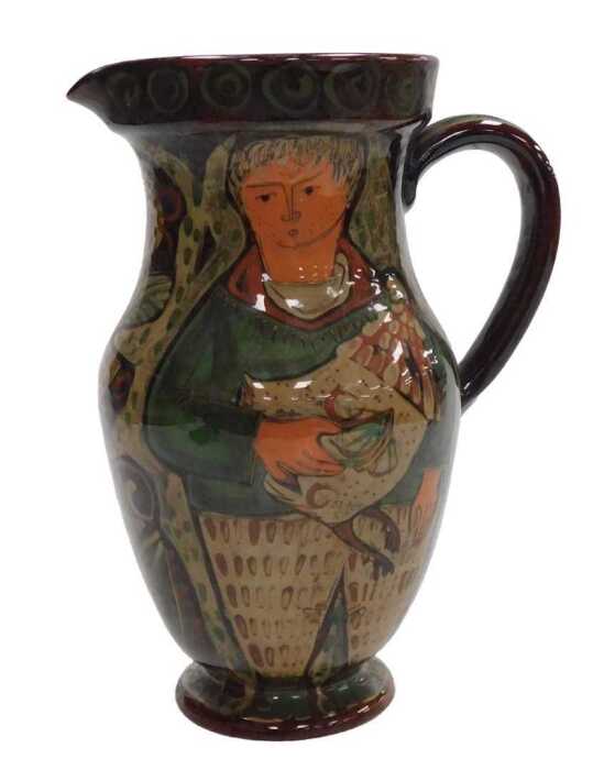 A late 19th/early 20thC pottery jug, possibly Scandinavian, painted with a man holding a goose...