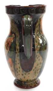 A late 19th/early 20thC pottery jug, possibly Scandinavian, painted with a man holding a goose... - 4