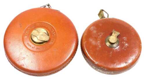A Raybone Chesterman Limited 20m leather bound tape measure, together with a Treble leather...