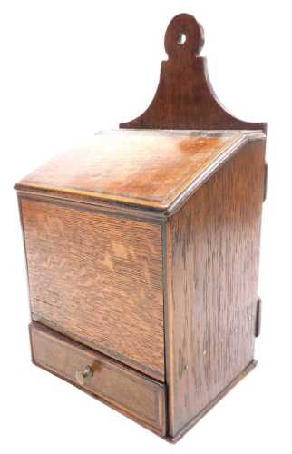 A Georgian oak candle box, with ebony and boxwood line inlay, having a hinged lid and frieze...