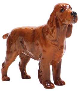 A Beswick pottery figure of a Cocker Spaniel, C H. Horseshoe Primula printed marks and paper label.