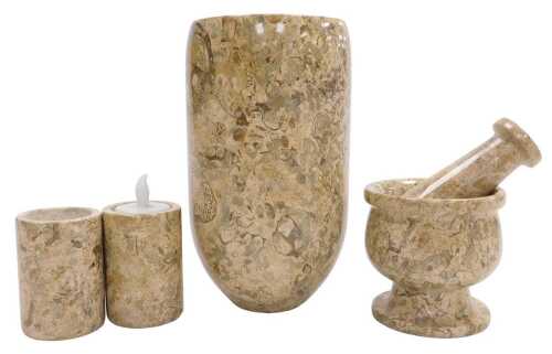 A fossil stone pestle and mortar, together with an oval vase, 20cm high, and two candle holders....