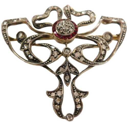 A Victorian diamond and ruby bow brooch, in bi-coloured metal, possibly silver gilt, 11.8g.