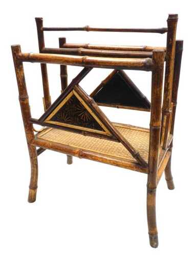 A Victorian Aesthetic bamboo twin division Canterbury, with floral decorated triangular panels,...
