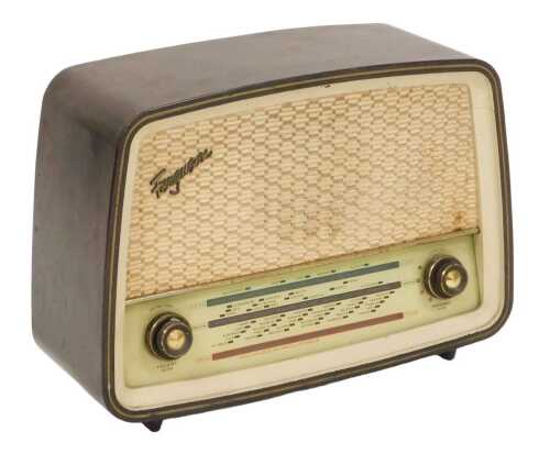A mid century Ferguson radio, in a faux wood Bakelite case, model 382U RG, serial number 5134,...