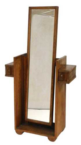 An Art Deco oak robing mirror, the mirror with a rectangular mirror plate, raised on a base...