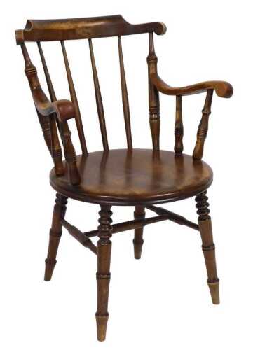 A Victorian beech penny seated Windsor chair, raised on turned legs united by a H frame stretcher.