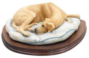 A Border Fine Arts sculpture of a Great Dane, by E Waugh, modelled recumbent upon a turquoise...