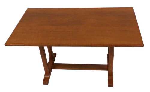 A Reynolds of Ludlow oak refectory dining table, raised on chamfered supports united by a...