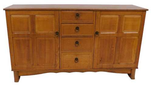 A Reynolds of Ludlow oak sideboard, with four graduated central frieze drawers, flanked by a...