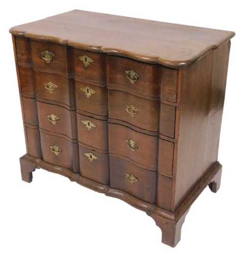 An 18thC Dutch oak serpentine chest, of four long drawers, raised on bracket feet, 79cm high,...