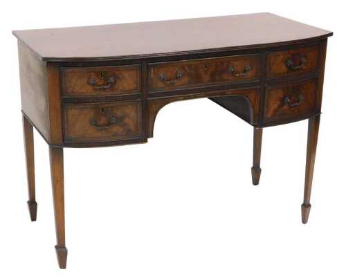 A Georgian style mahogany bow front kneehole desk, by A Gardner & Son Limited of Glasgow, with...