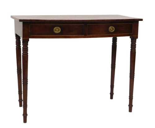 An early 19thC Georgian mahogany bow front side table, with two frieze drawers, raised on ring...
