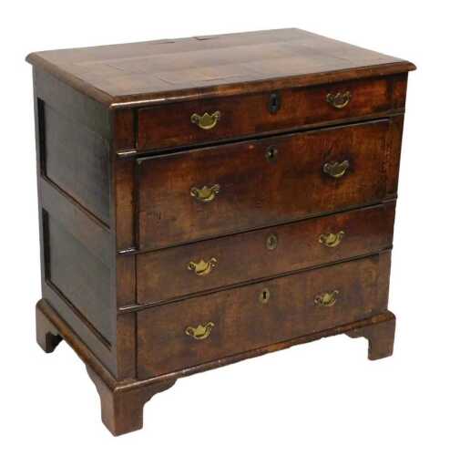An early 18thC Georgian mahogany and cross banded chest, of four long drawers of varying depths,...