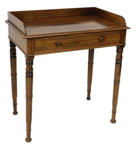 A Victorian mahogany wash stand, with a three sided gallery, above a frieze drawer, raised on...
