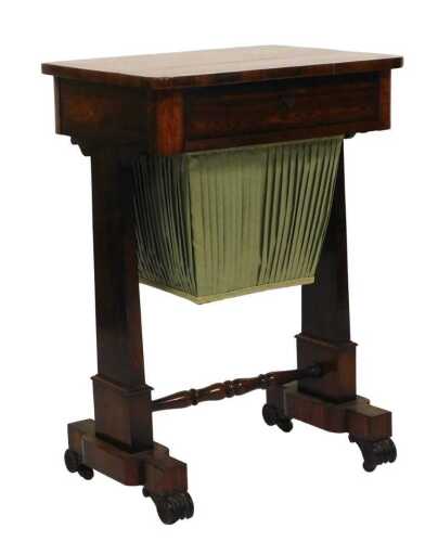 A Victorian rosewood sewing table, with burr walnut crossbanding, with a frieze drawer over a...