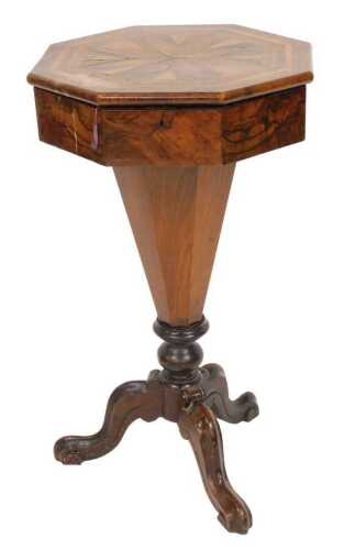 A Victorian walnut and marquetry inlaid drum sewing table, the hinged octagonal top decorated in...
