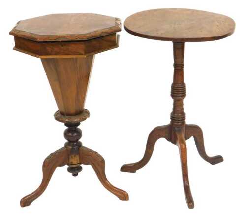 A Victorian walnut drum sewing table, the hinged octagonal top opening to reveal a fitted...