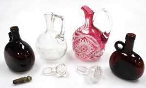 A Bohemian cranberry cut glass claret jug, with a clear glass stopper, 26cm high, further clear... - 2