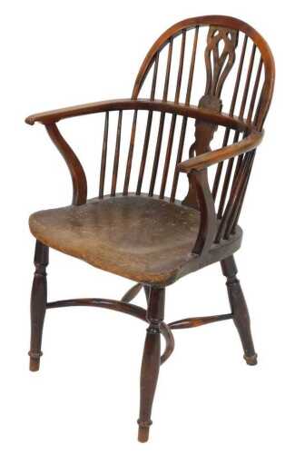 A 19thC yew and elm Windsor chair, with a pierced and carved vase shaped splat, and a solid...