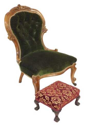 A Victorian mahogany balloon back nursing chair, with a foliate carved crest rail, upholstered...