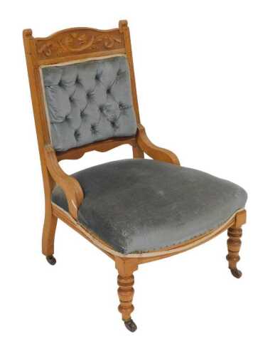 A Victorian oak armchair, the crest rail carved with beasts and foliate scrolls, with an...