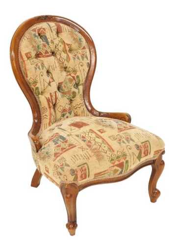 A Victorian mahogany spoonback nursing chair, with button upholstered back and overstuffed...