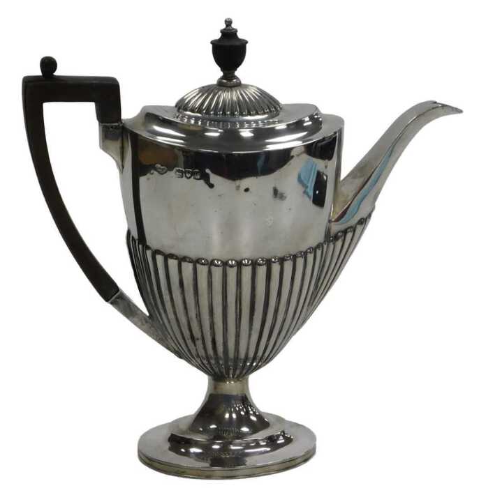 An Edward VII silver semi fluted coffee pot, Goldsmiths & Silversmiths Company, London 1907,...