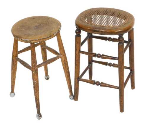 A 19thC beech and cane seated stool, raised on turned legs united by turned stretchers, together...