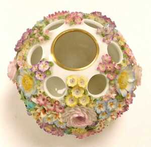 A Coalport Coalbrookdale porcelain flower encrusted vase, raised on three scroll feet, CC62,... - 2