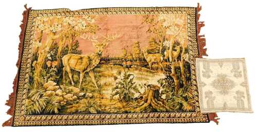 A 20thC tapestry wall hanging rug, decorated with deer in a forest, 123cm x 183cm, together with...
