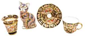 A Royal Crown Derby porcelain Imari cat paperweight, gold stopper, together with an Imari coffee...