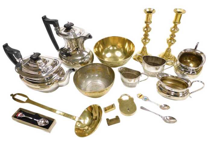 A group of brass and plated wares, including a four piece plated tea and coffee set, a brass...