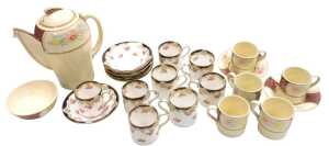 A mid century Suzie Cooper pottery Kestrel shape part coffee service, decorated with reserves of...