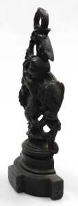 A Victorian cast iron door stop, modelled with a putto and vines, 42cm high. - 3