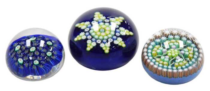 A Perthshire glass paperweight, with spiral twists and millefiori canes, a further Perthshire...