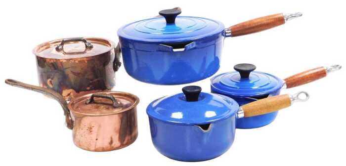 A Le Creuset blue enamel saucepan and lid, a pair of Cousance graduated blue enamel saucepans...