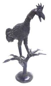 A cast iron figure of a cockerel, modelled perched on a divided tree trunk, and a circular base,...