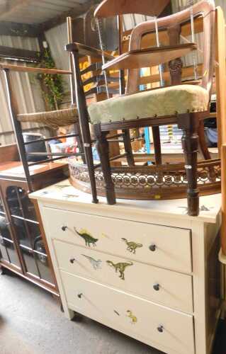 A contemporary white chest, of three graduated drawers, embellished with dinosaur stickers, 97cm...