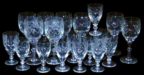 A set of eight Webb Corbett Georgian pattern wine glasses, together with eleven port glasses.
