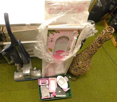 A child's doll's house (disassembled), in pink, with a quantity of doll's furniture, together...