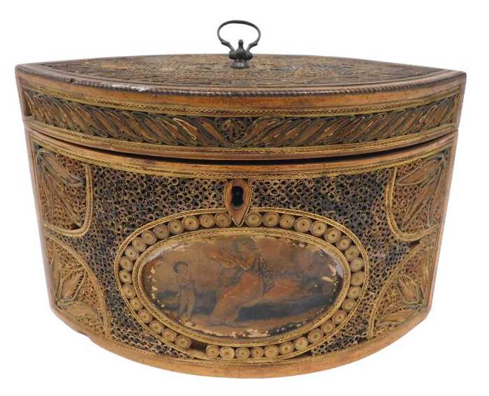 A George III navette shaped paper scroll tea caddy, the heavily carved lid with loop handle,...