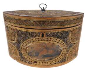 A George III navette shaped paper scroll tea caddy, the heavily carved lid with loop handle,...