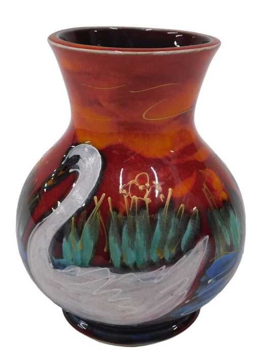 A 20thC Anita Harris pottery swan vase, of bulbous form on a circular foot, hand painted in red,...