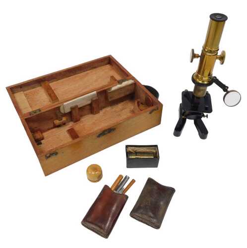 An early 20thC part brass microscope, with articulated cylindrical stem, fixed iron stage with...